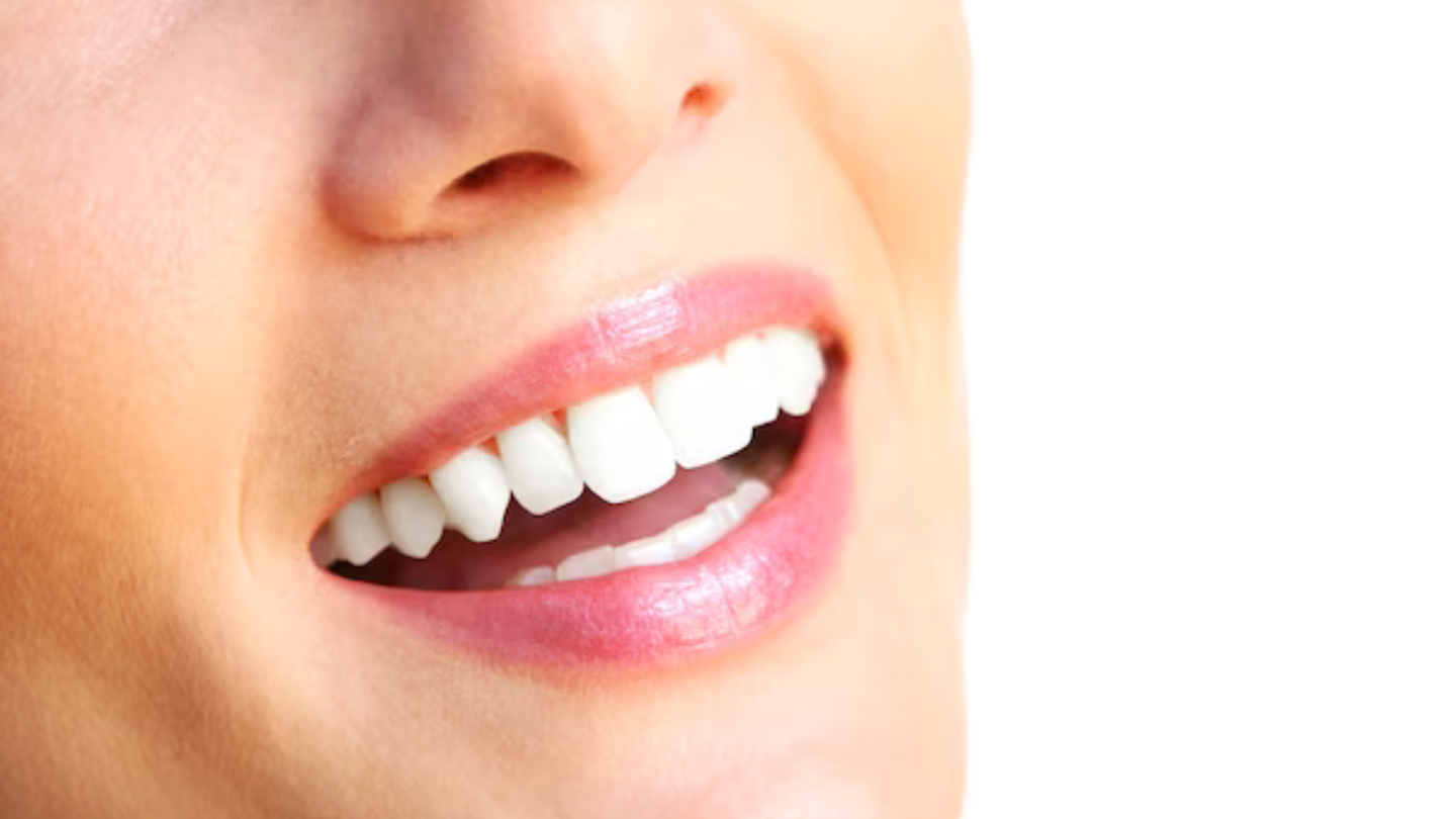 A female beautiful smile over white background